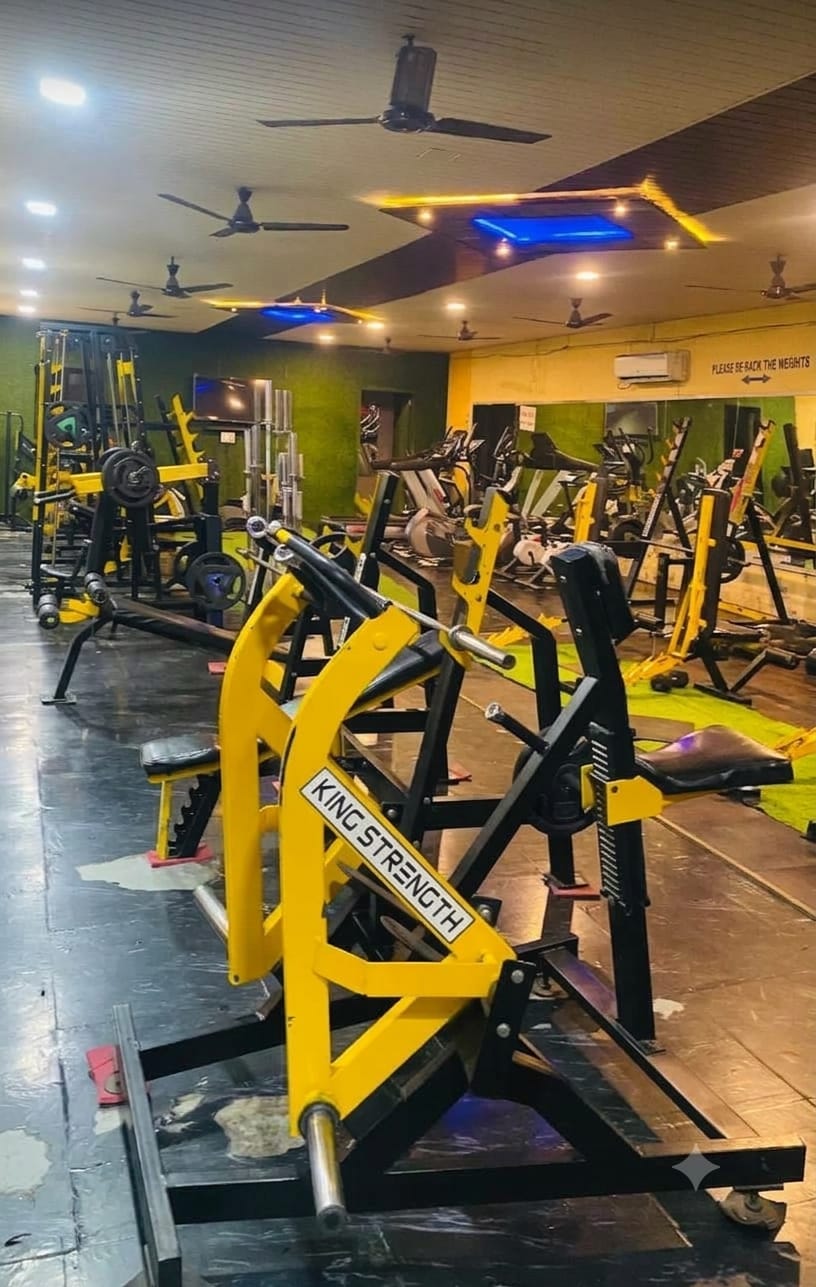 Yellow resistance machines on the Bhandari Gym workout floor